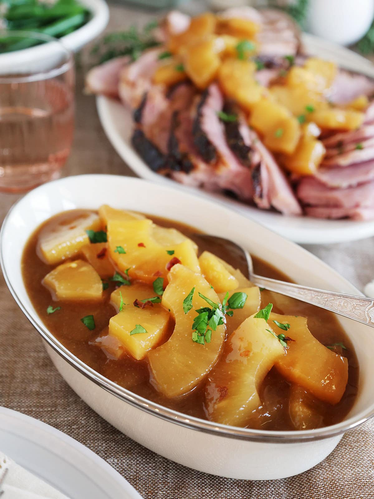 An oblong bowl filled with pineapple sauce.