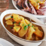 An oblong dish filled with pineapple sauce.
