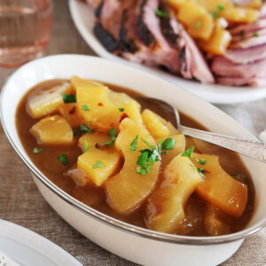 An oblong dish filled with pineapple sauce.