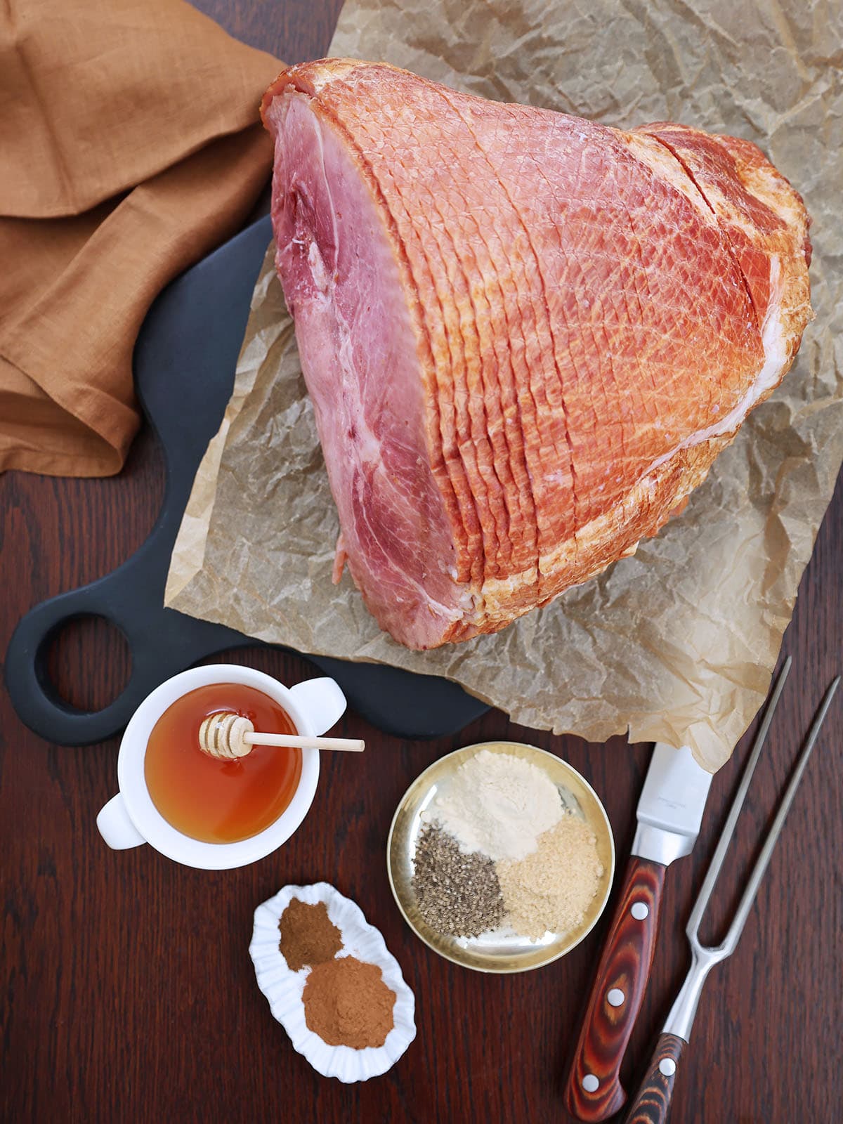 Ingredients needed to make a roast ham with honey glaze.