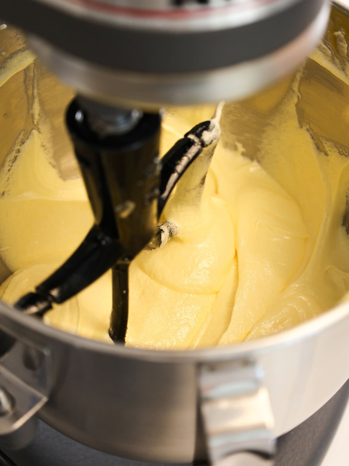 Almond pound cake batter in a mixing bowl.