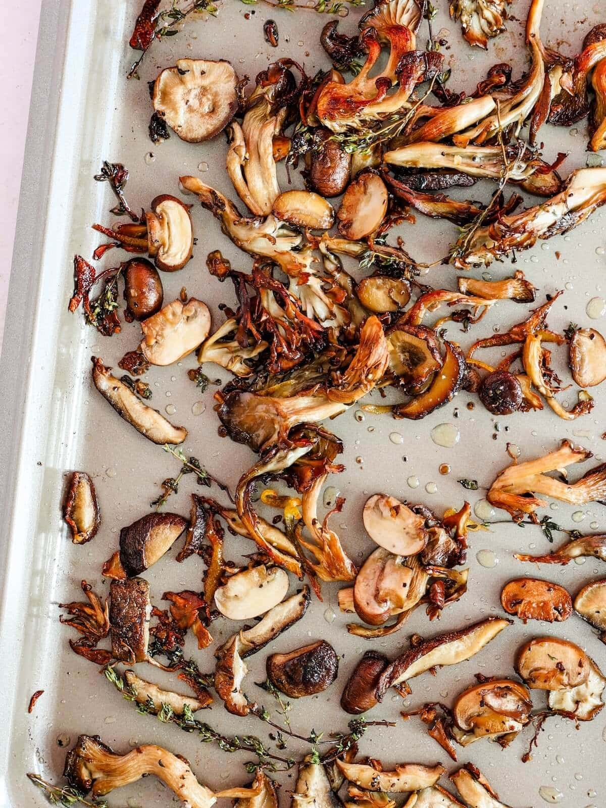 roasted and crispy mushrooms on a sheet pan.