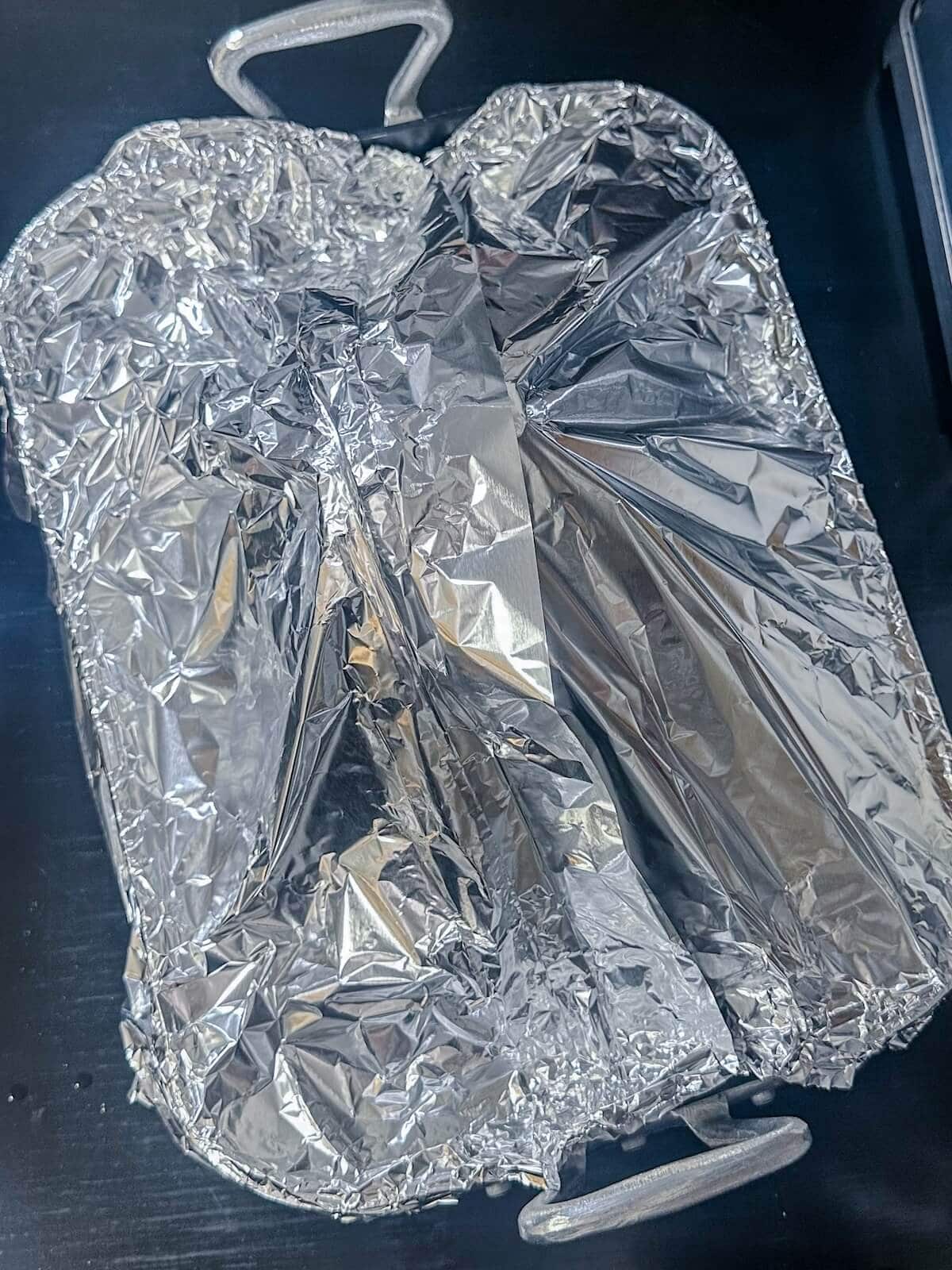 Baking pan wrapped with foil.