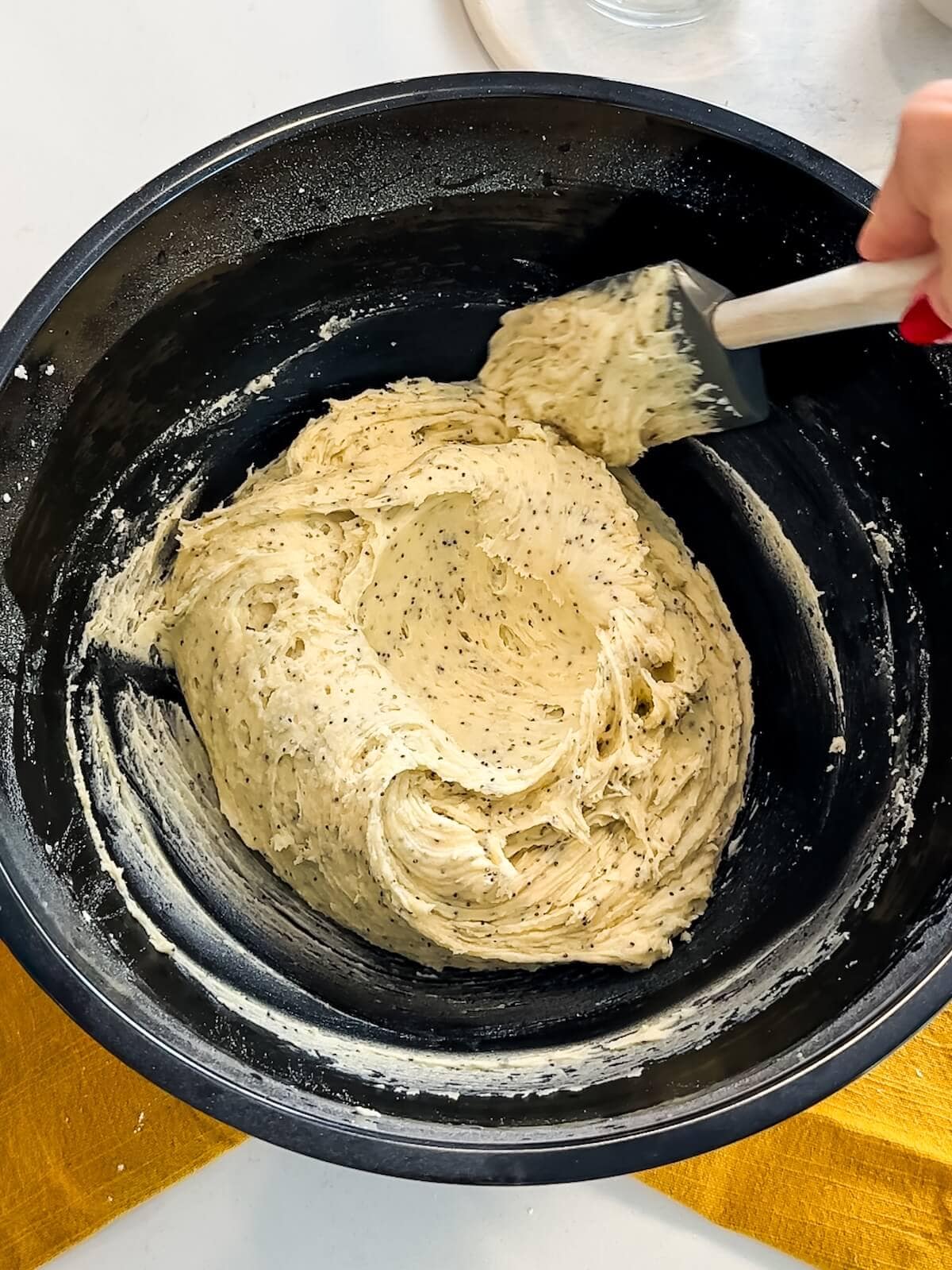 lemon poppyseed cookie dough batter in a bowl.