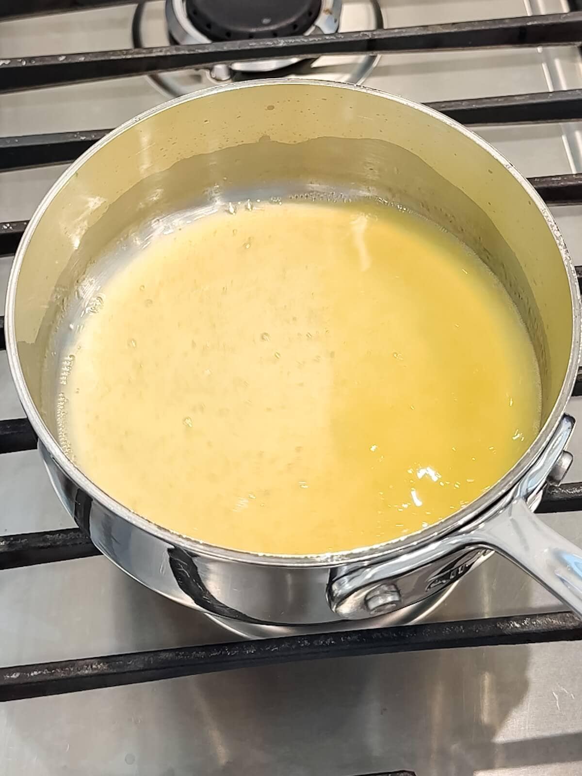 reducing lemon juice to a concentrate in a pan on the stove.
