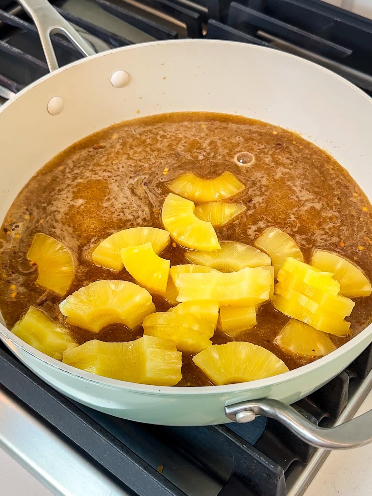 Add pineapple to pan with sauce ingredients.