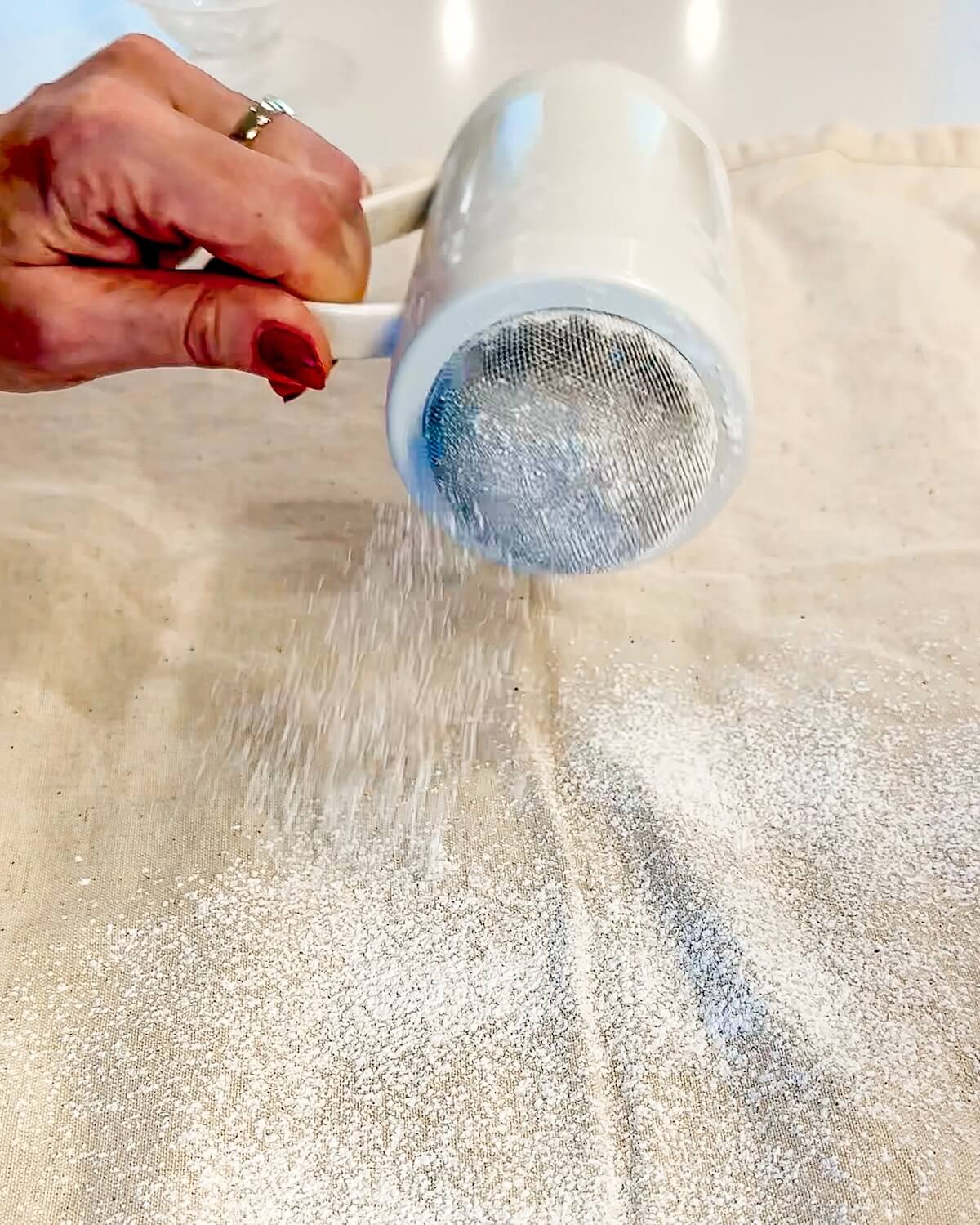 dusting a clean towel with confectioners' sugar.