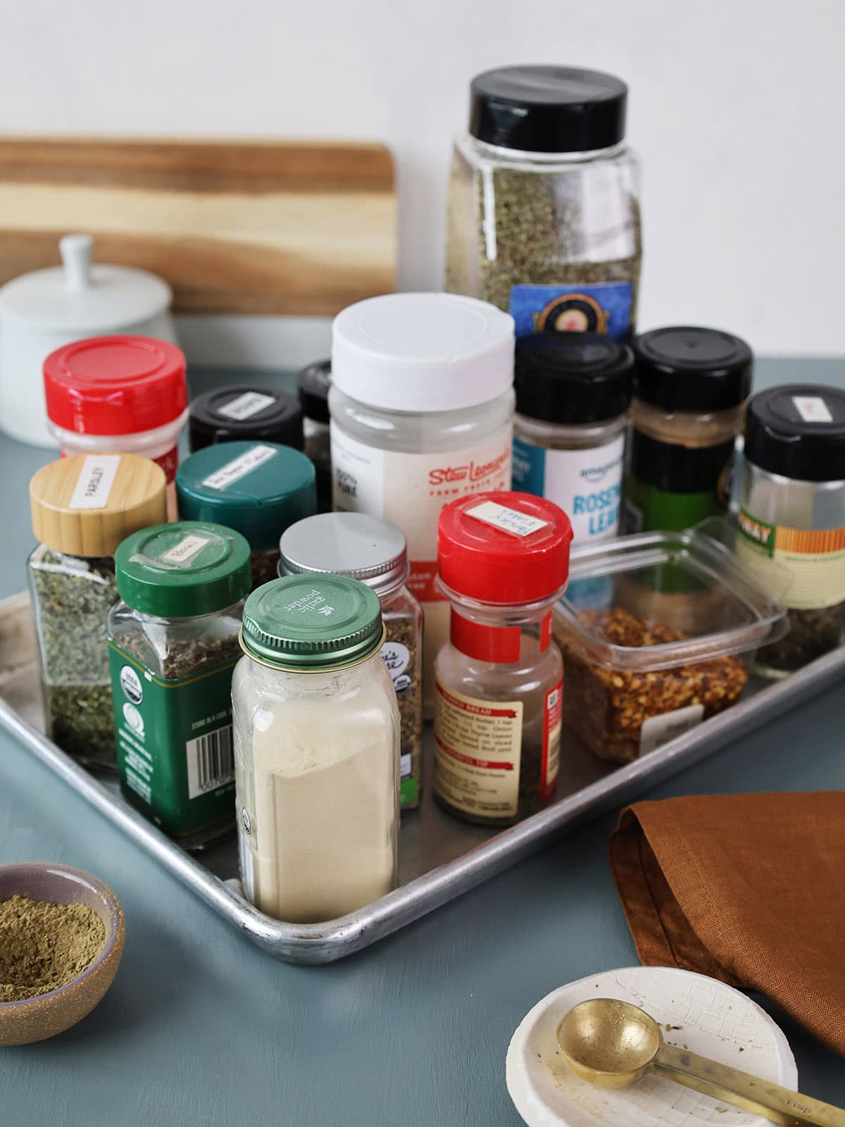 A baking sheet topped with a variety of spices.