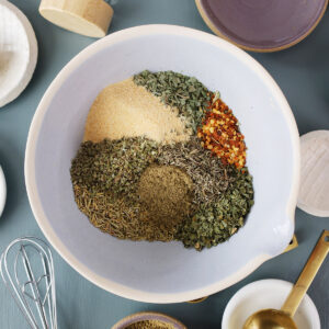 Top view of a bowl filled with multiple spices.