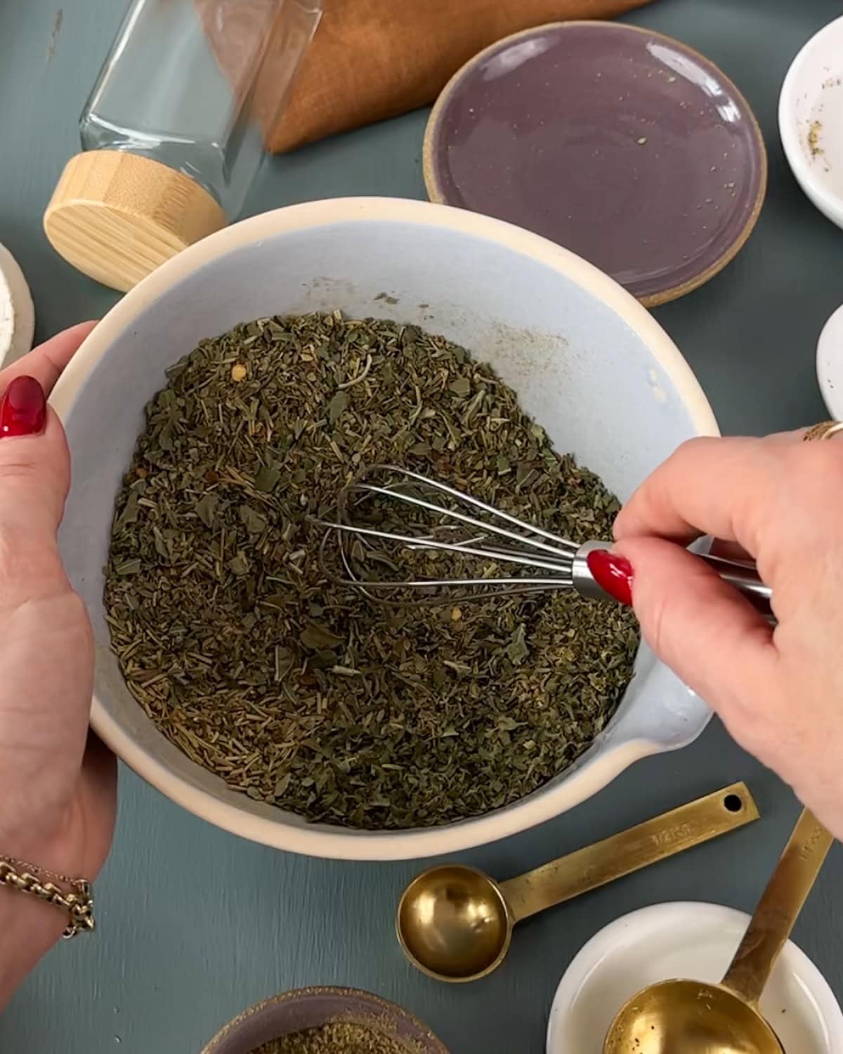 Stirring all the herbs and spices together for Italian seasoning.