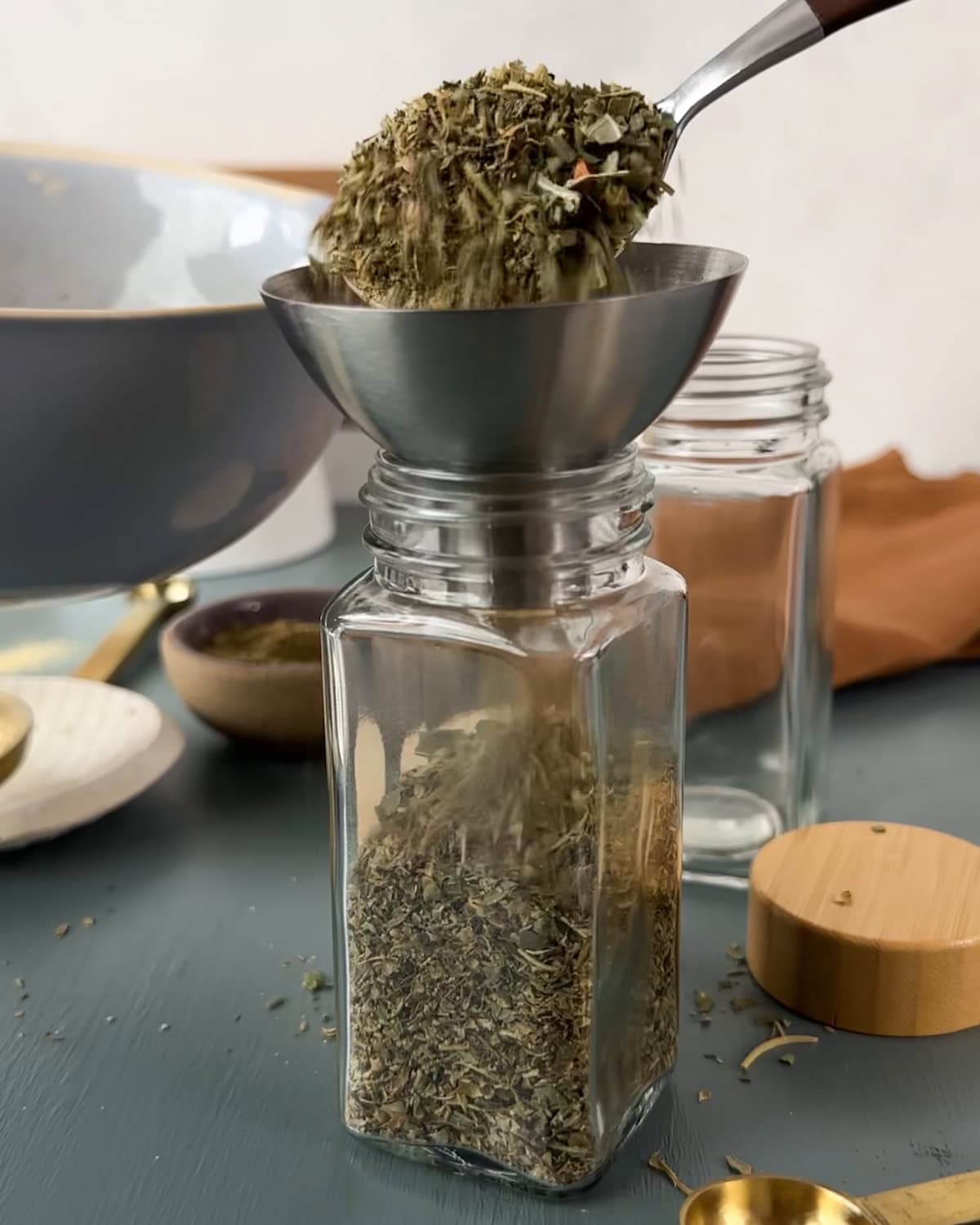 Use a funnel to fill spice jars with seasonings.