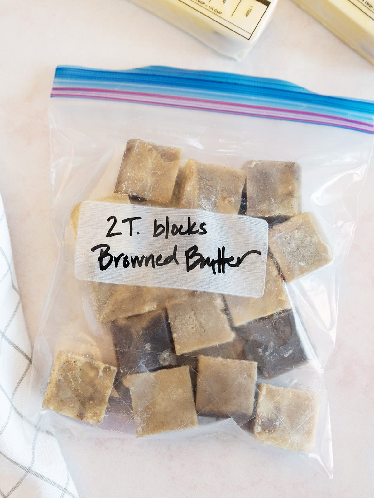 Browned butter cubes labeled in a plastic zipper bag.