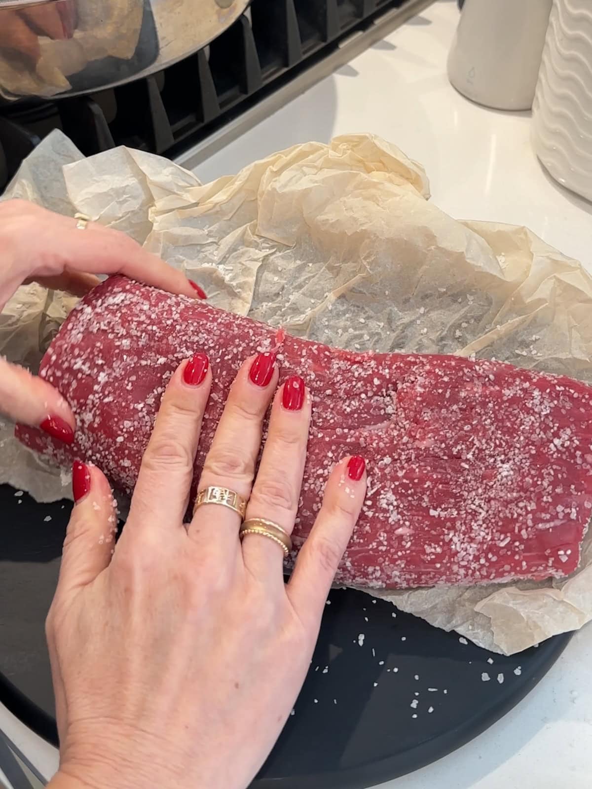rubbing a beef tenderloin with salt before cooking.