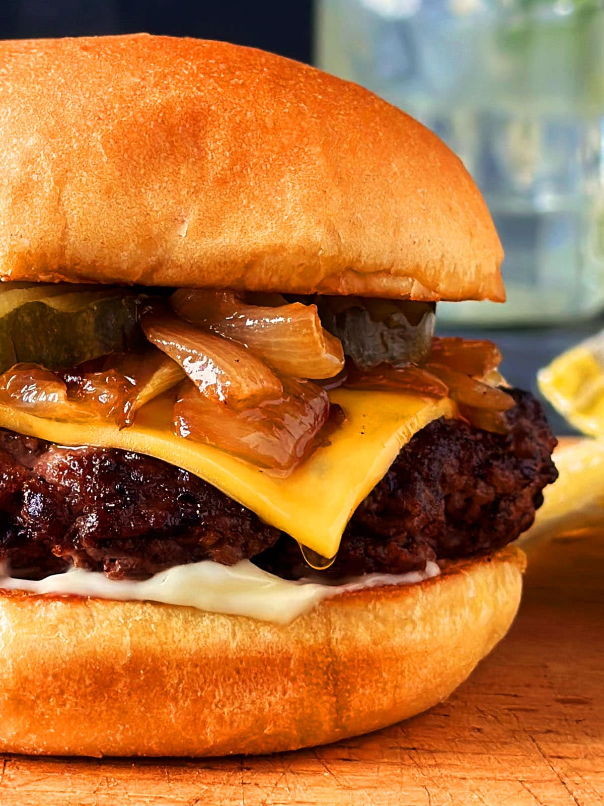 Close up of the side of  a butter burger on a wooden cutting board