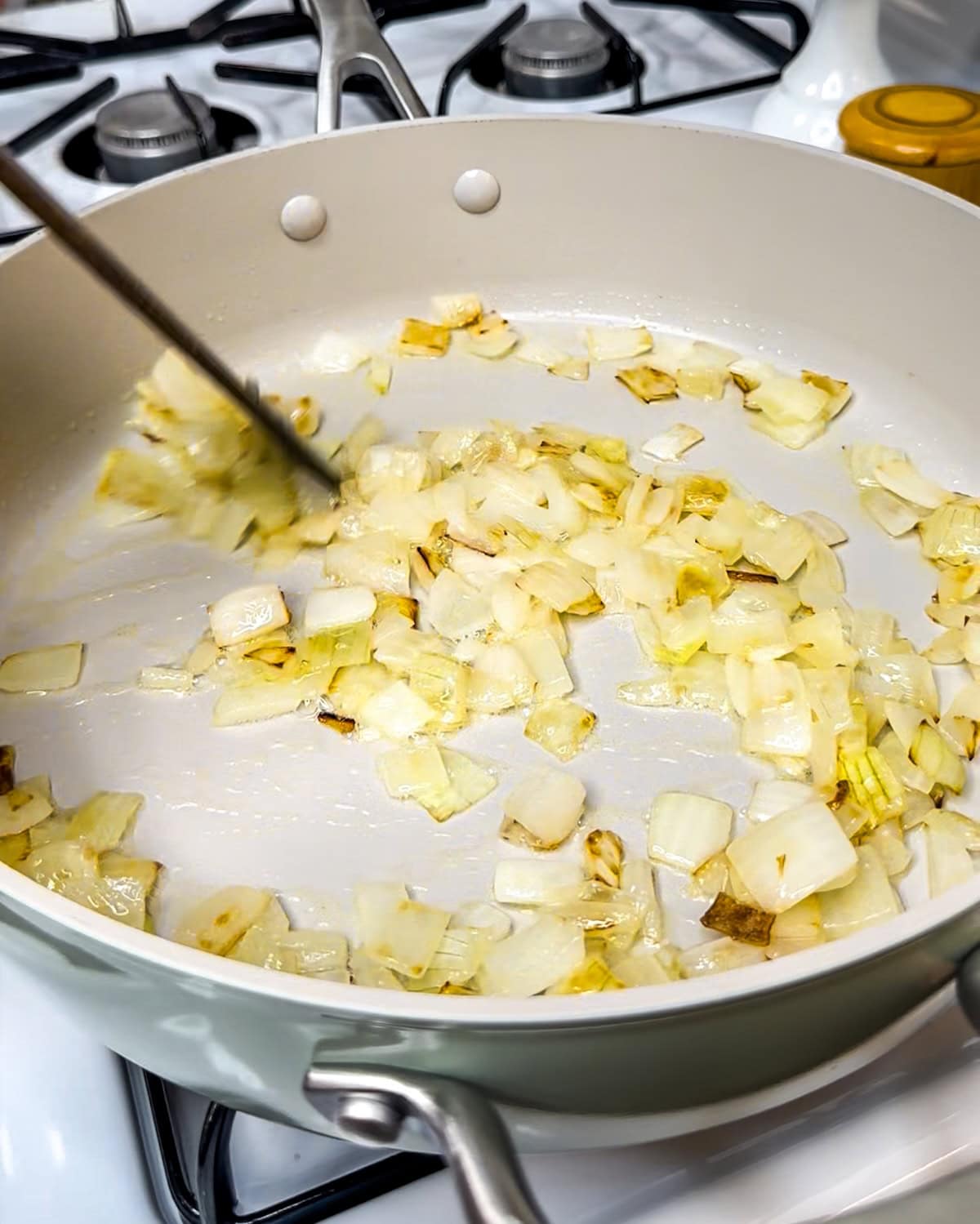 Cooked onions in a skillet. 