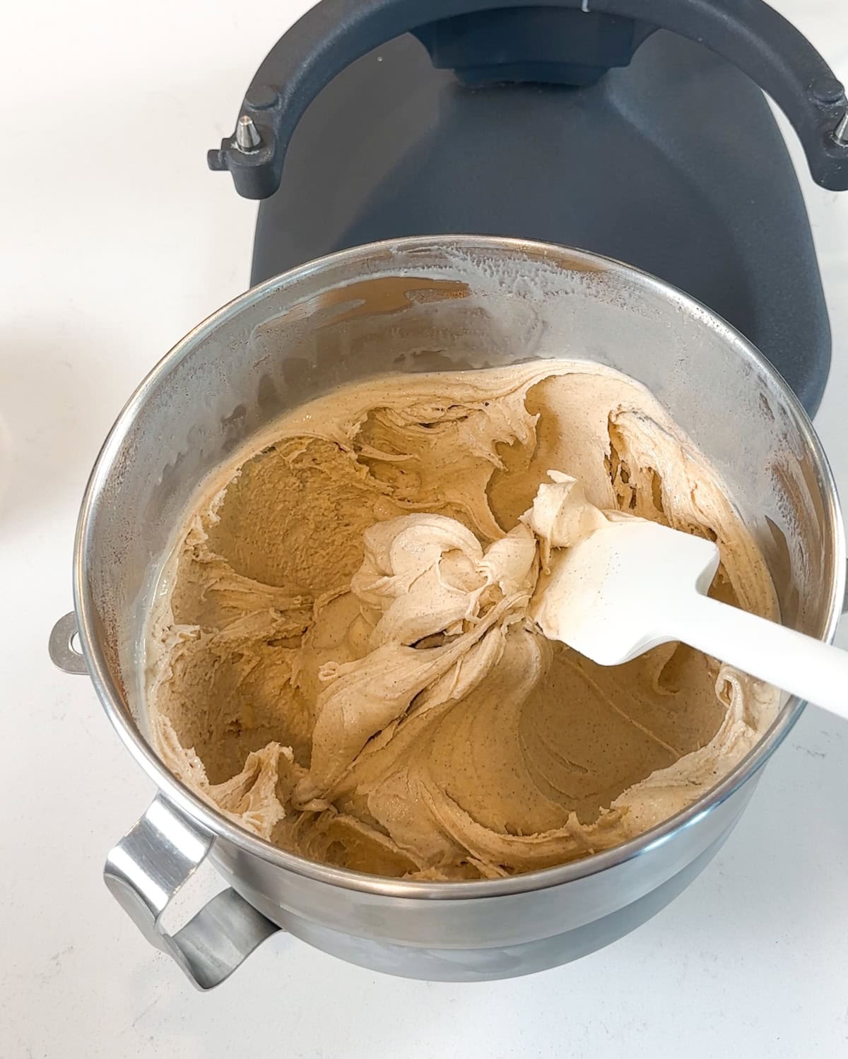 A bowl of softened cinnamon ice cream.