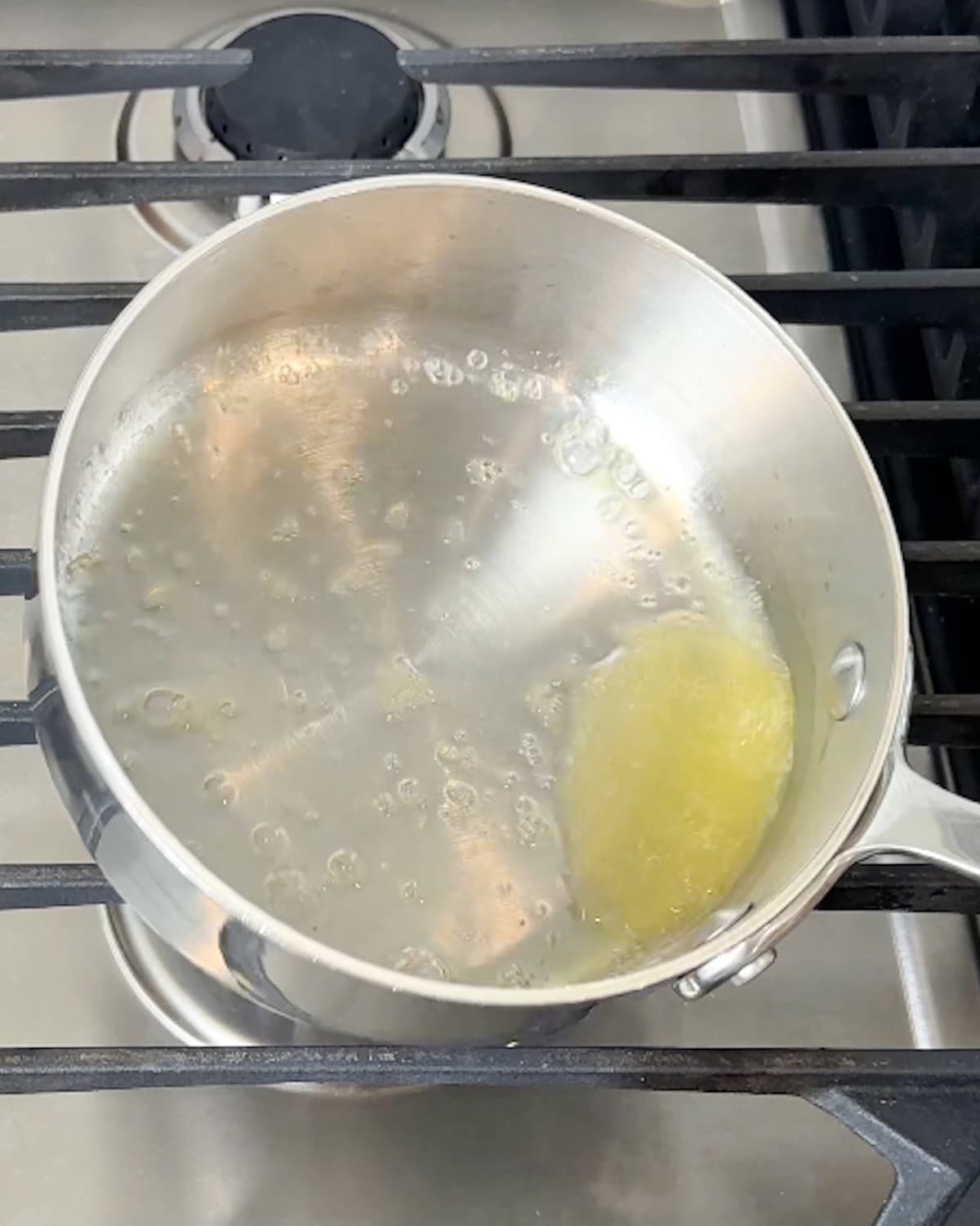 Reduced lemon juice in a saucepan.