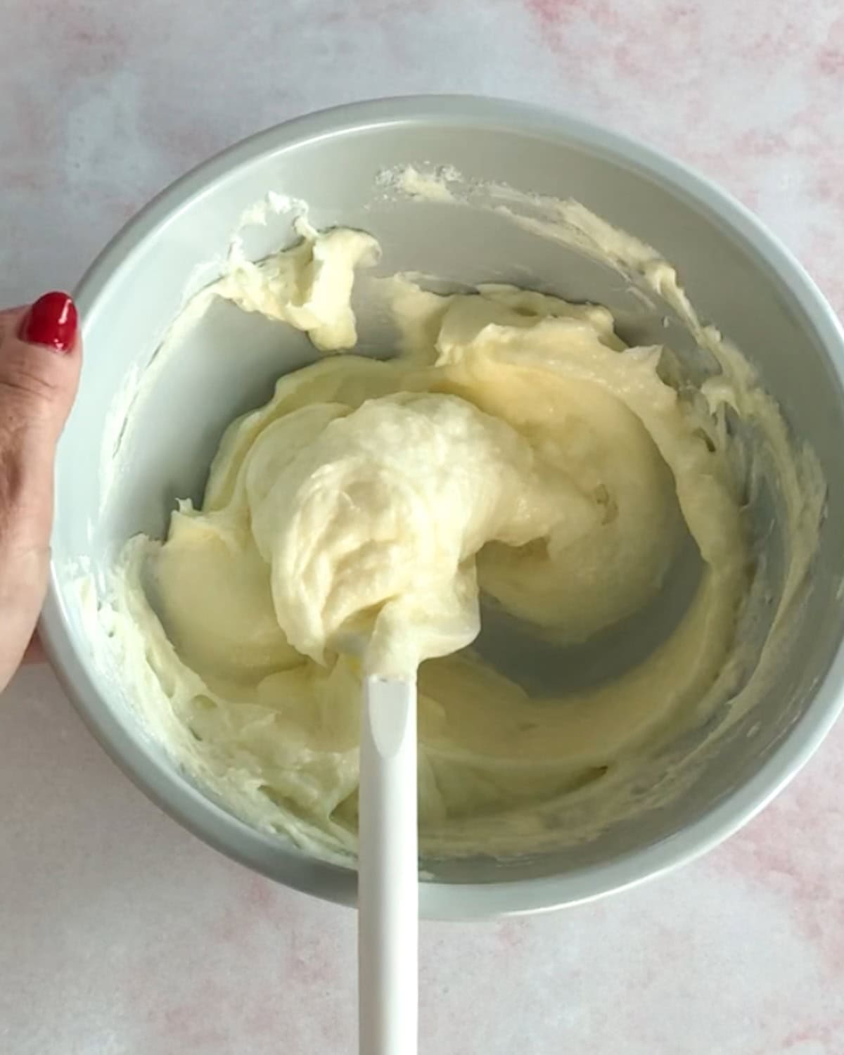 cream cheese and sugar mixed together in a bowl for bread pudding.