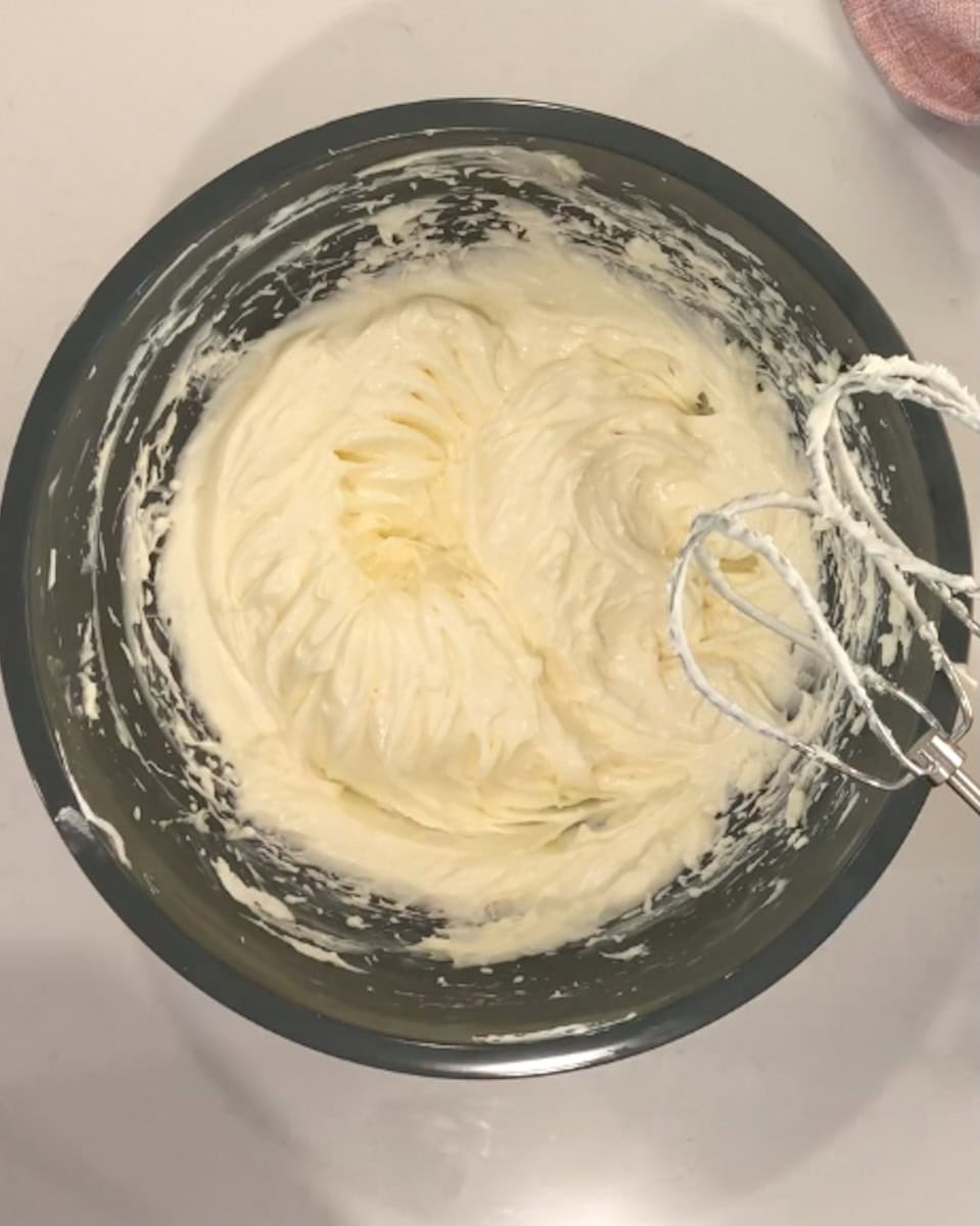 Mixture of cream cheese and marshmallow creme in a bowl.